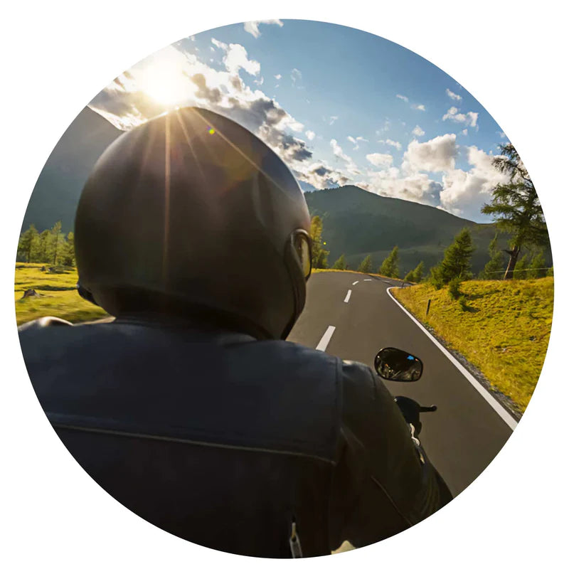 Person Riding Motorcycle in Mountains wearing CURVD Everyday Earplugs to block out engine noice and enjoy the ride more