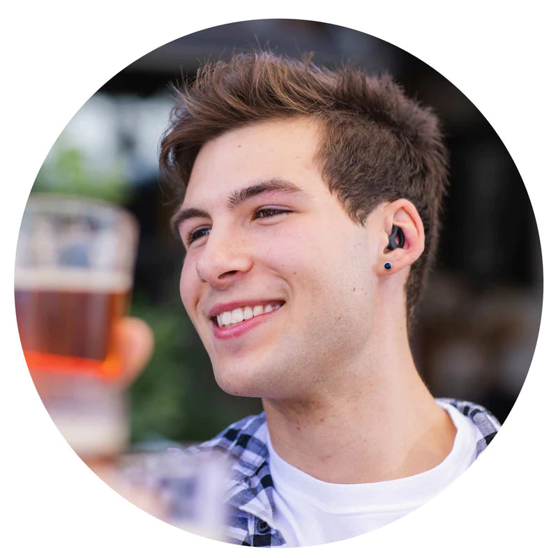 Attractive Young Man Wearing Black Low-profile, Ultra-soft CURVD Earplugs