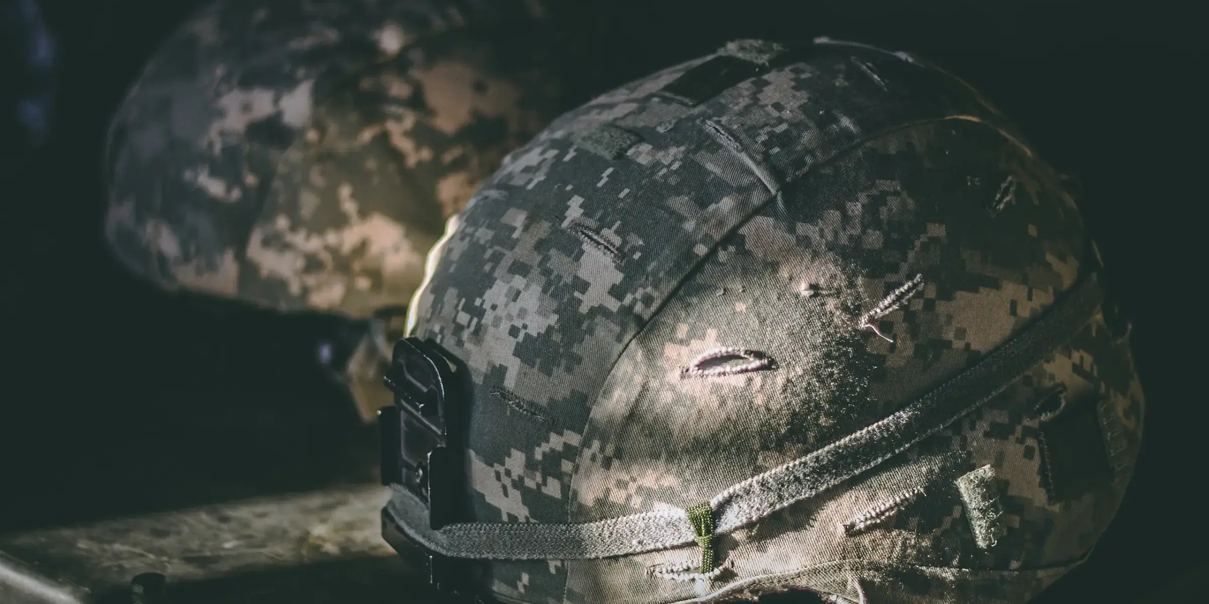 Image of Two Army, Navy, Military Helmets Showing CURVDs Support of the Military